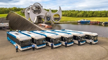 Row of battery electric buses displayed at a European transit facility
